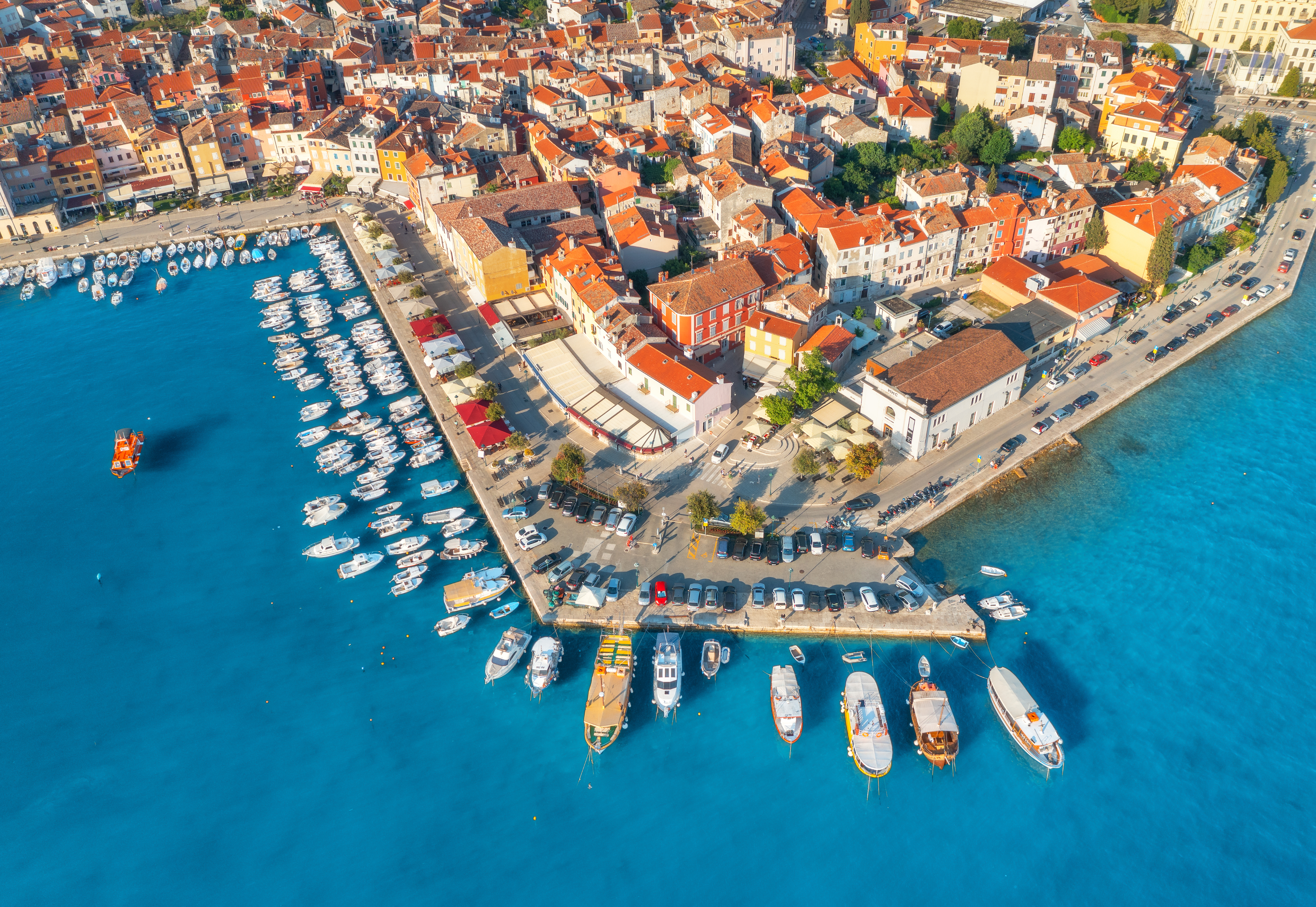 Aerial view of Split harbour with red roofs and boats on blue water